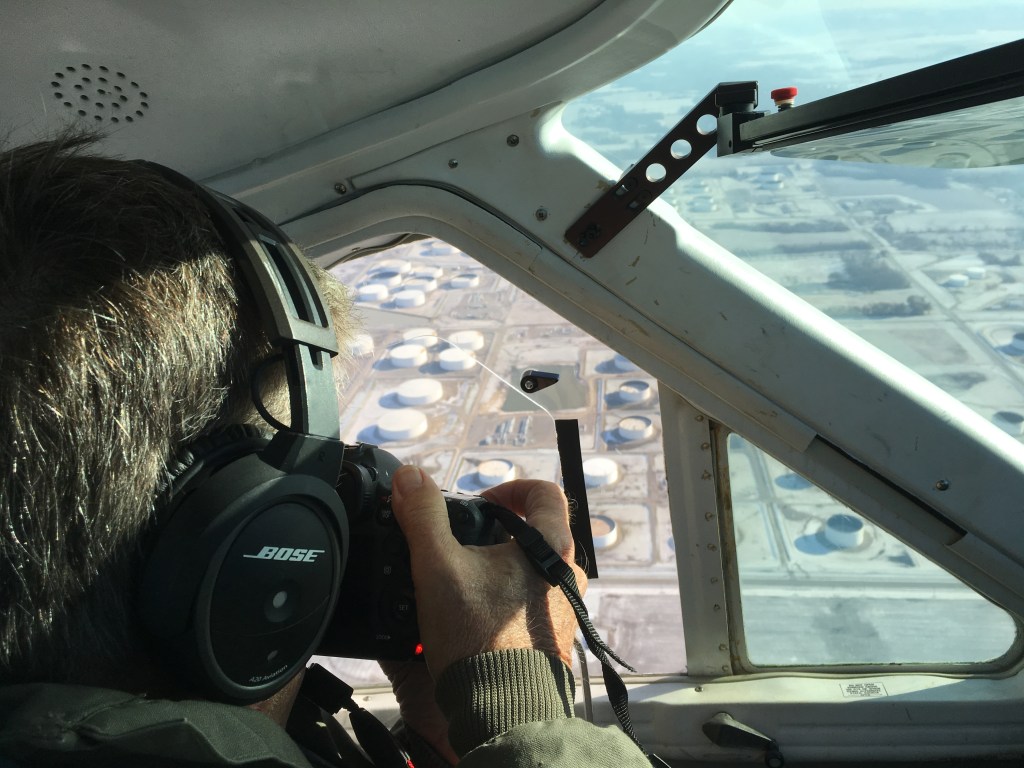 Airplane aerial photographer shooting an oblique angle.
